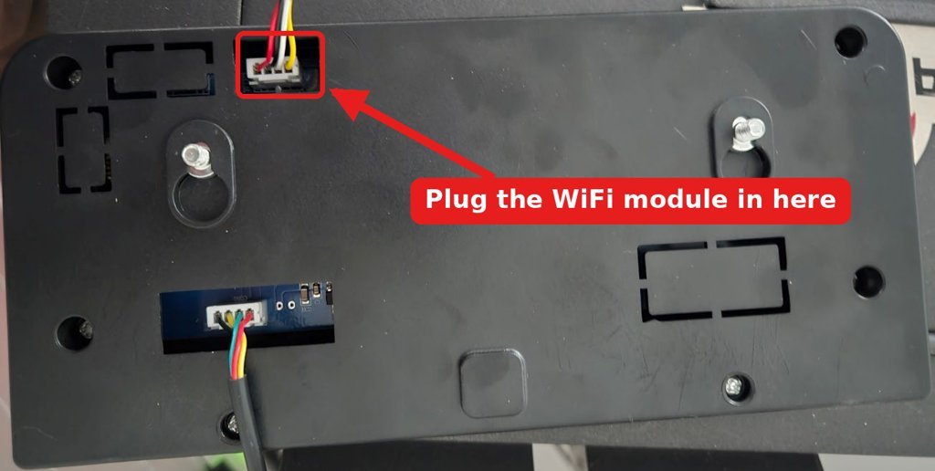 Back of the pellet stove control panel with the 4-pin port at the top marked where the WiFi module plugs in